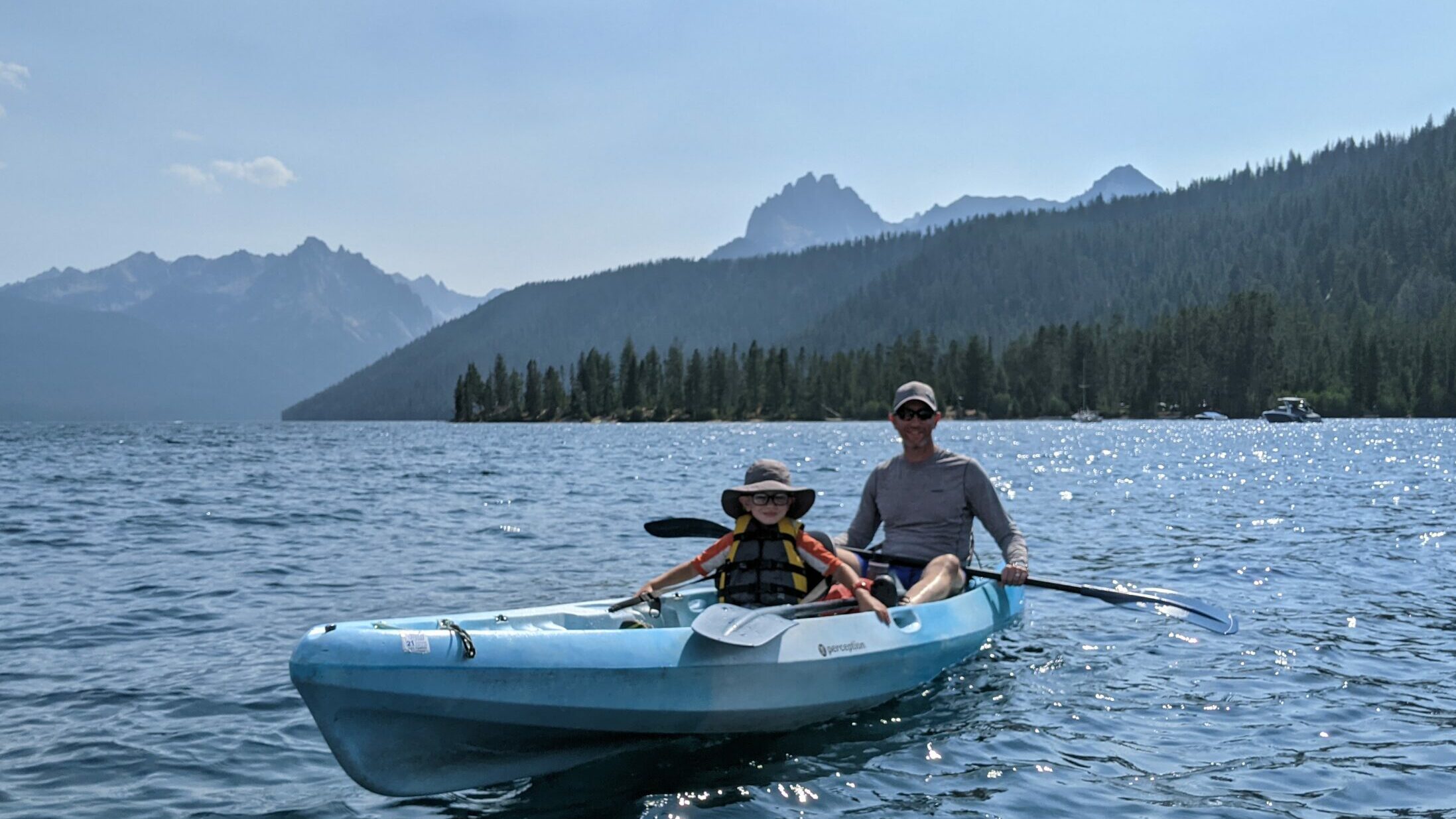 People canoeing on a lake.