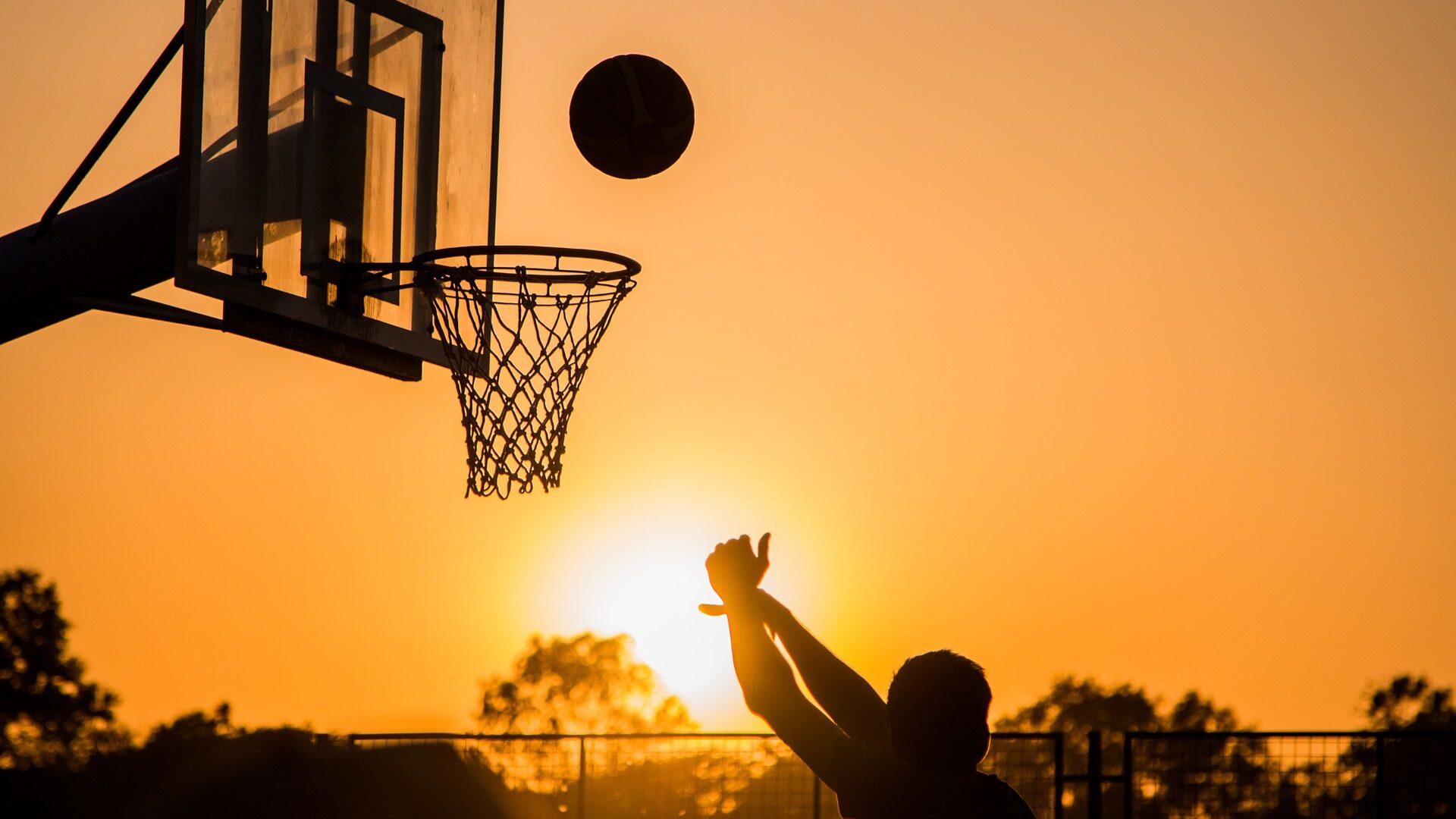 Basketball at sunset.